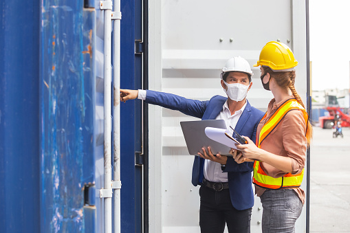 https://www.ceosummitoftheamericas.com/building-inspectors/teamwork-foreman-man-and-woman-wearing-protection-face-mask-and-picture-id1241151425/